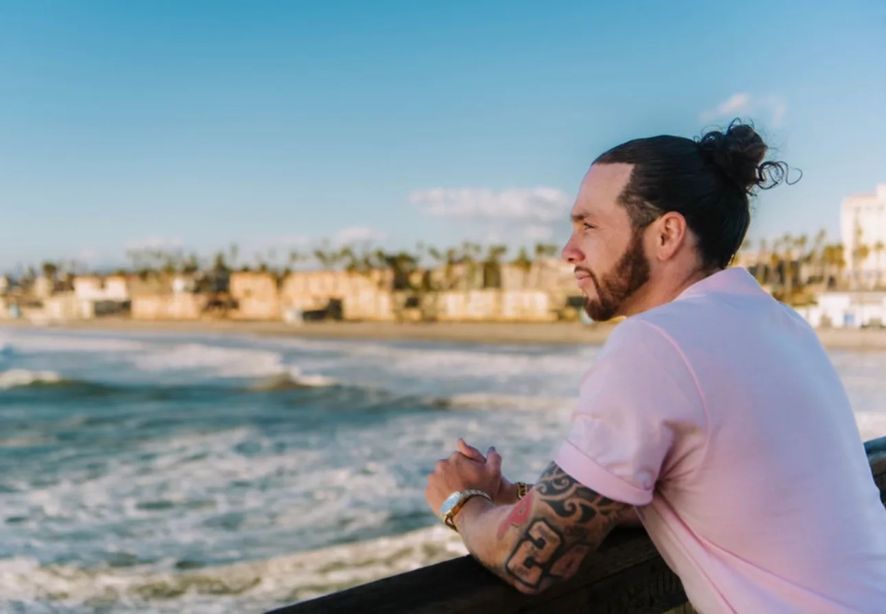 Rudy Perez Jr. looking out over the water from a pier